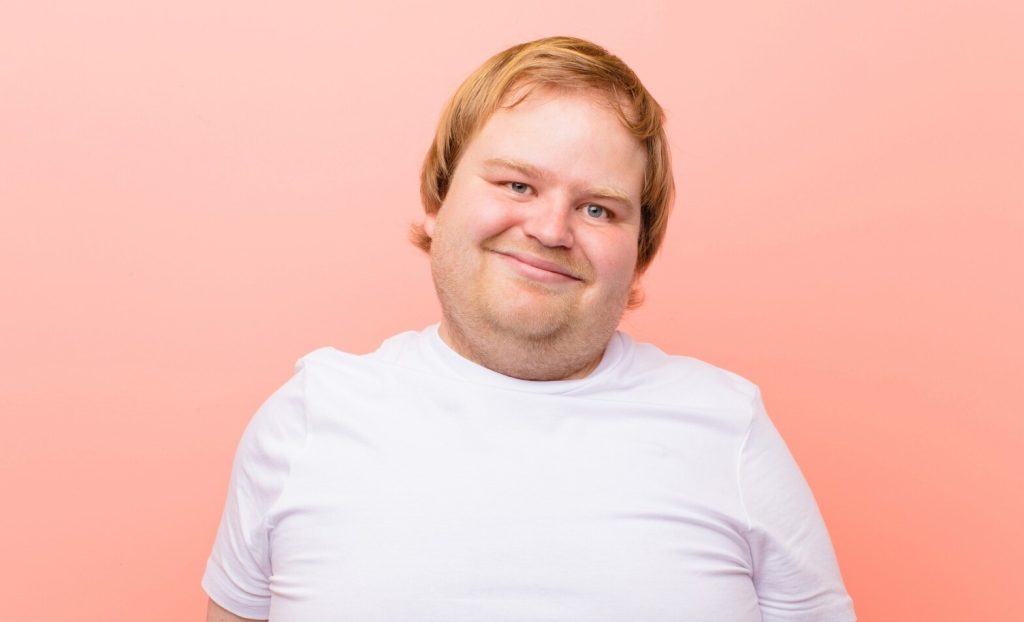 Happy disabled man smiling at camera