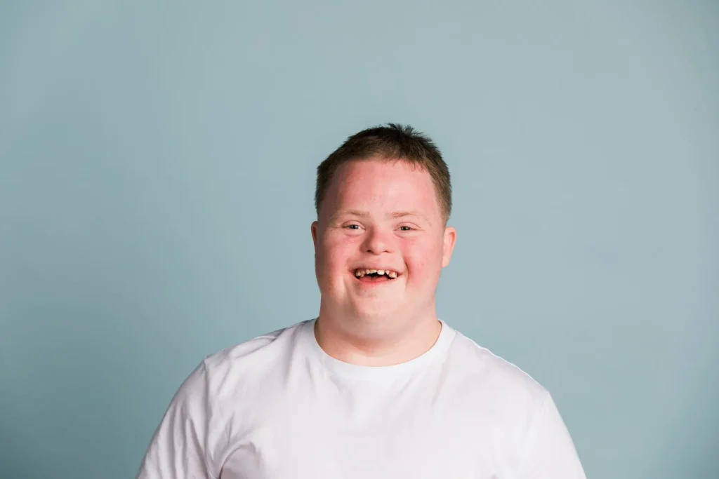 Happy Autistic boy smiling at camera